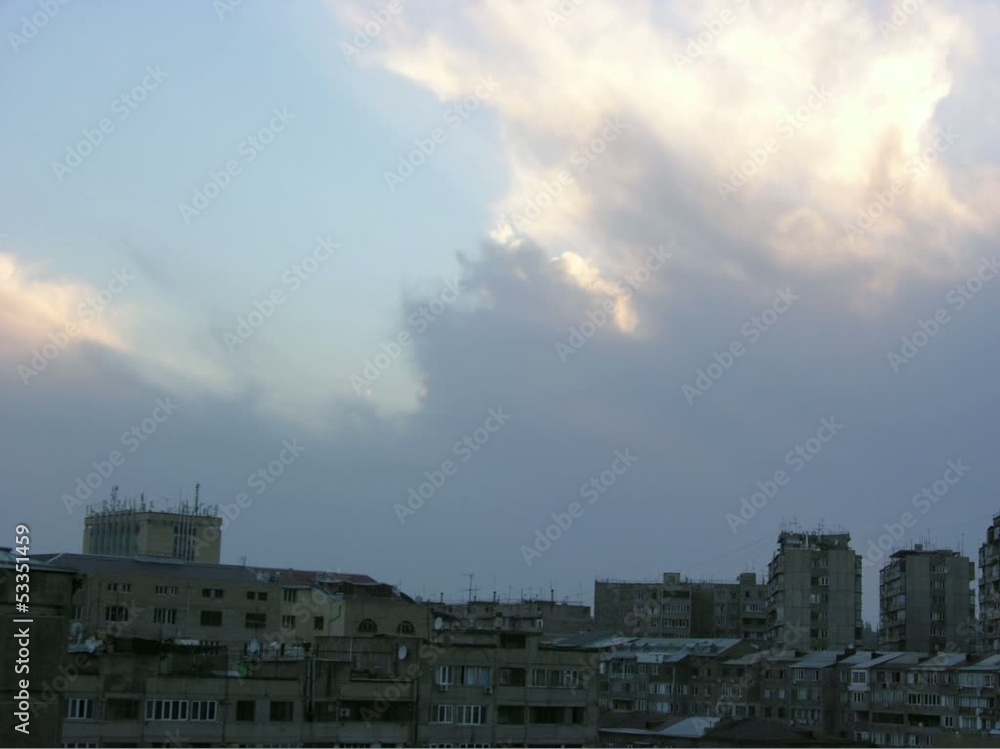 Sunset and moving clouds over city buildings. Time lapse Sunset and moving clouds over city buildings. Time lapse