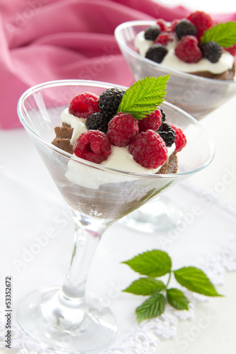 Chocolate mousse with raspberries and cream.