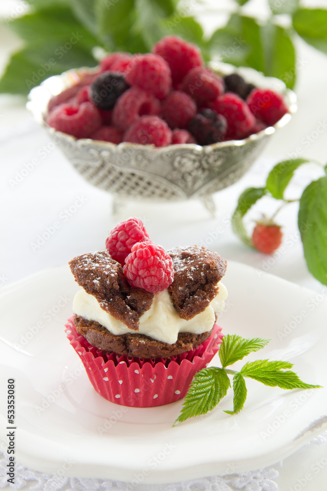 Chocolate muffins with raspberries and cream. Chocolate muffins with raspberries and cream.
