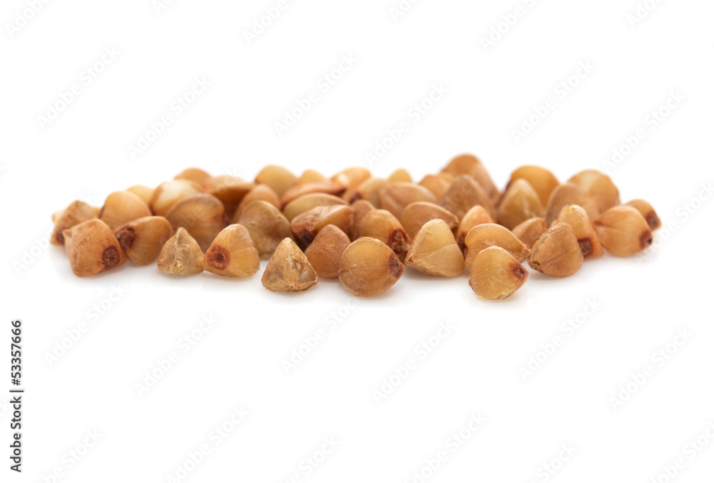 a little pile of buckwheat isolated on white a little pile of buckwheat isolated on white
