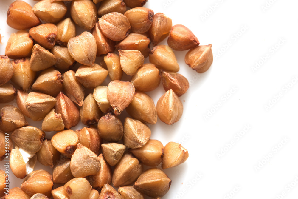 a little pile of buckwheat isolated on white a little pile of buckwheat isolated on white