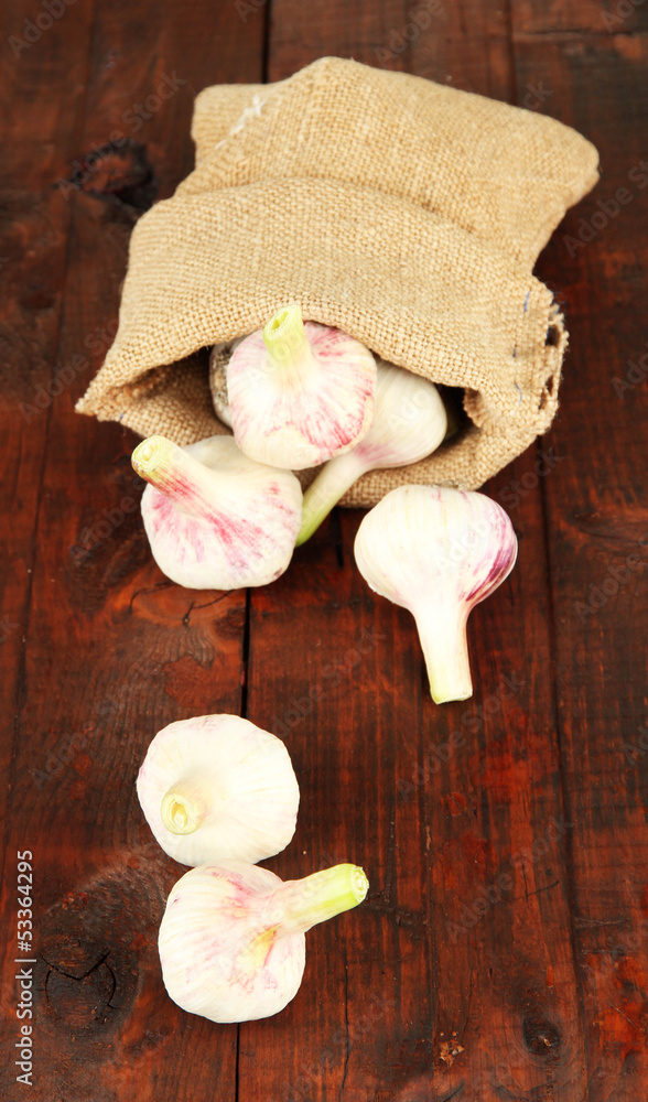 Fresh garlic, on wooden background