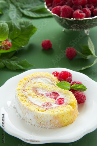 Roulade with raspberries and cream. photo