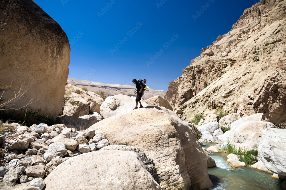 Hiker on the top of boulder