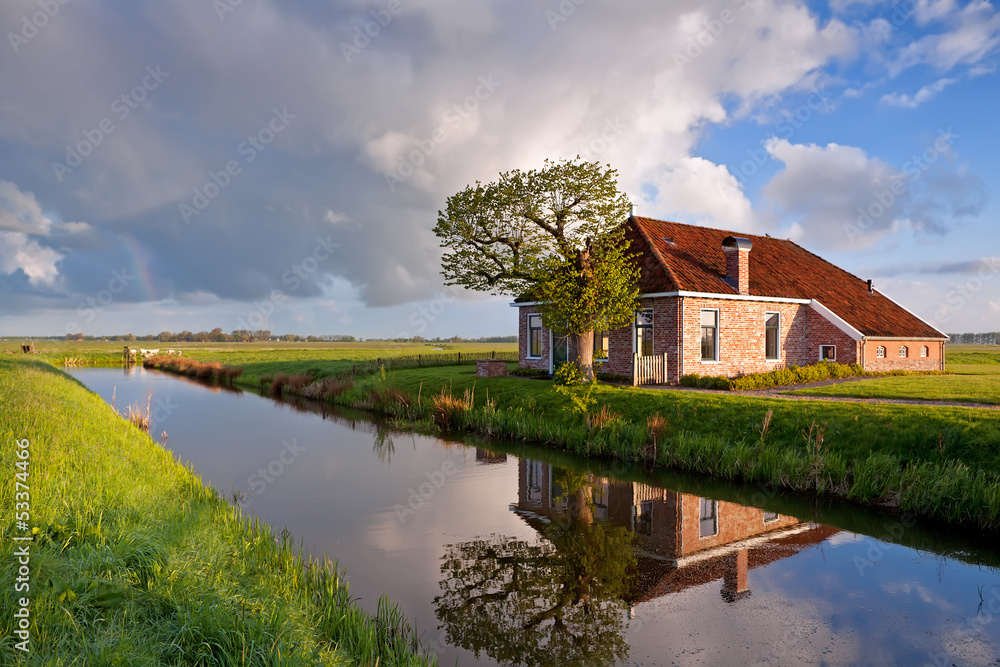 cozy and charming farmhouse by river - obrazy, fototapety, plakaty 