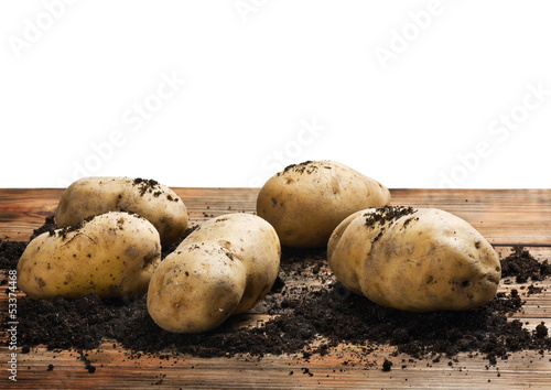 raw potatoes on the ground