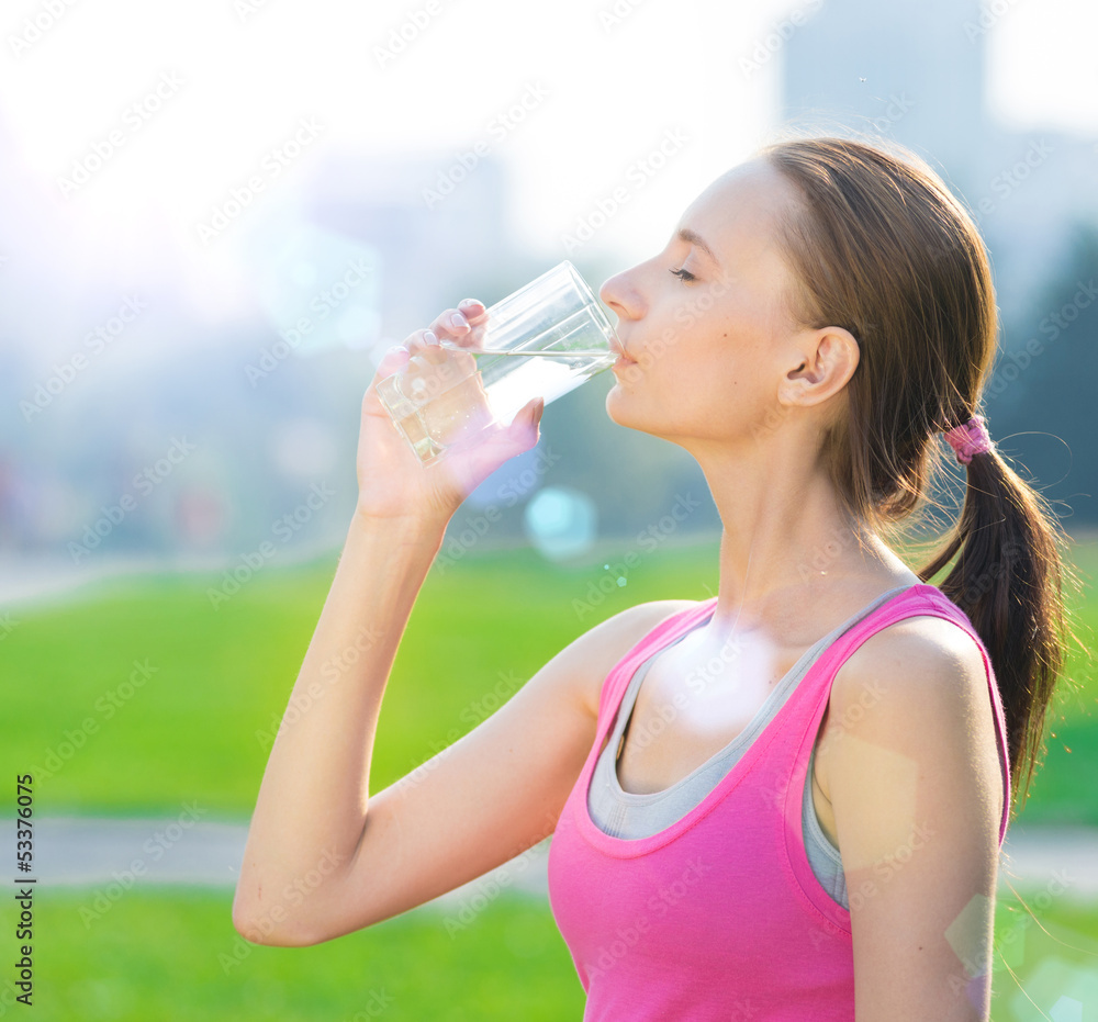 Portrait of woman drinking water after sport Portrait of woman drinking water after sport