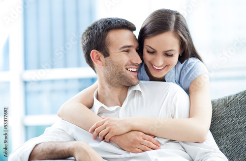 Couple hugging at home