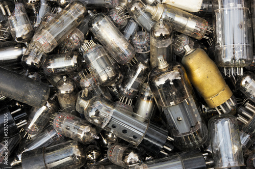 Heap of old vacuum tubes (relectronic components) photo