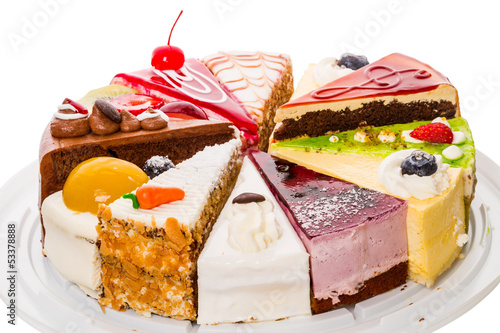 Different pieces of cake on white