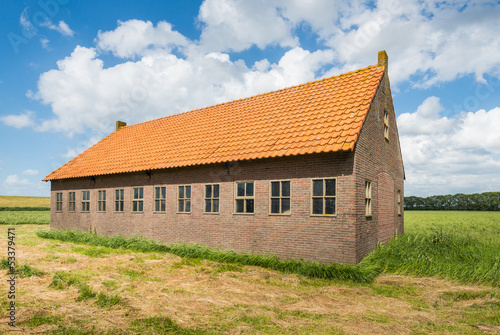Wallpaper Mural Old barn in a rural landscape with a blue sky and white clouds. Torontodigital.ca