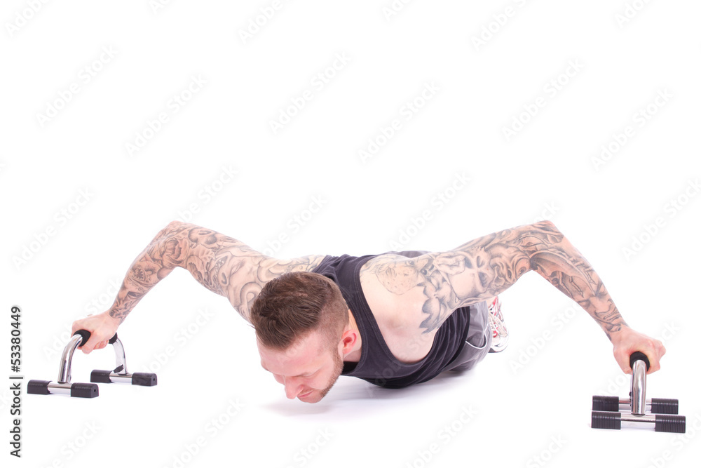 Obraz premium extrem breiter Liegestütz mit Push Up Gerät