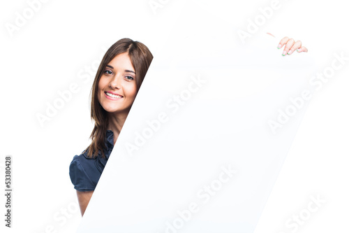 Portrait of a young woman with blank billboard