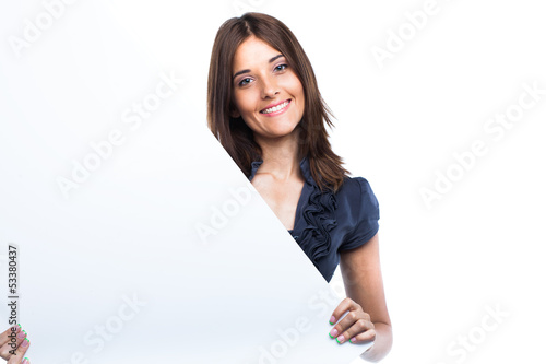 Portrait of a young woman with blank billboard