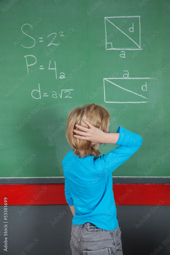 Confused Little Boy Looking At Board