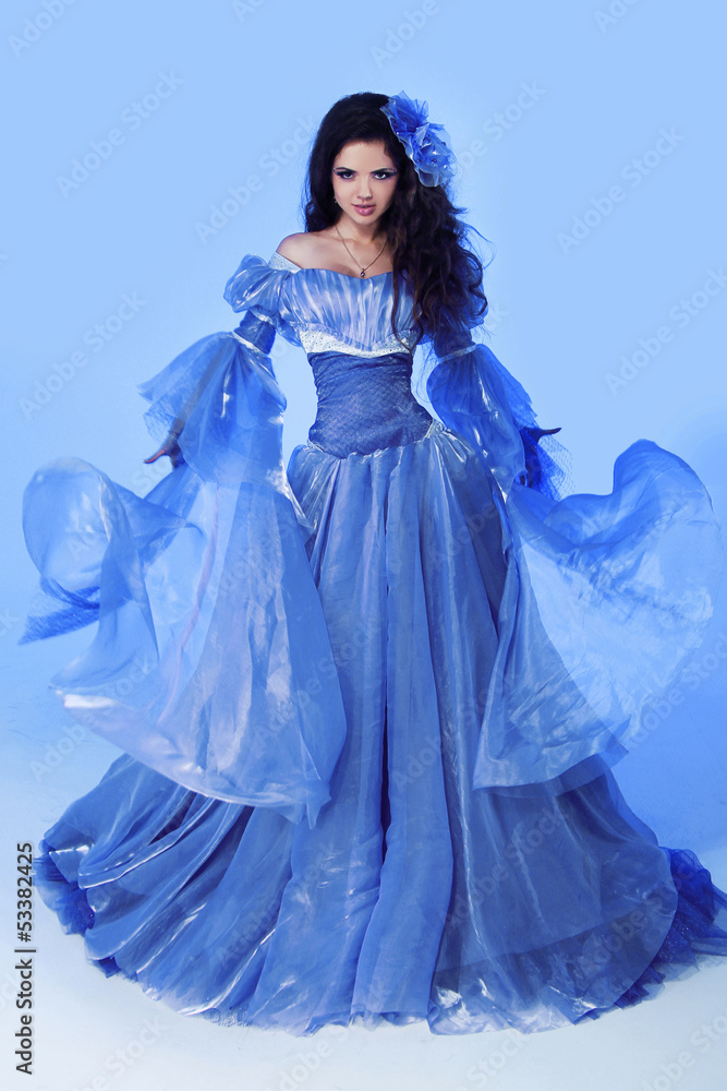 Fashion photo of beautiful woman in blowing magnificent dress. Fashion photo of beautiful woman in blowing magnificent dress.