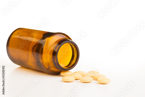 Empty jar with drug tablets