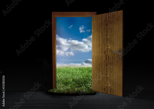 Opened door showing landscape of countryside
