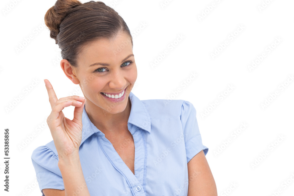Smiling businesswoman pointing upwards Smiling businesswoman pointing upwards