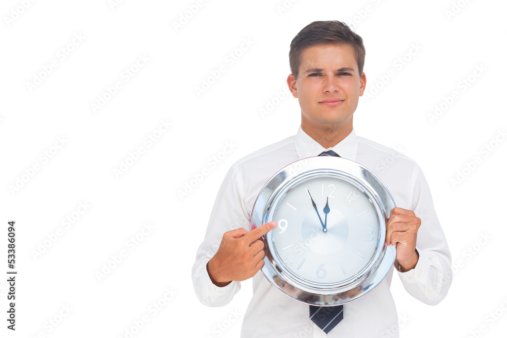 Businessman holding a clock Businessman holding a clock