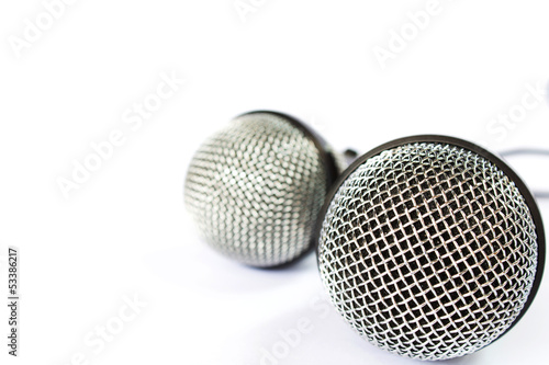 Microphone with black wire isolated on white