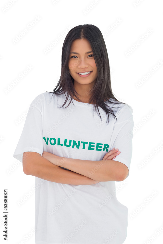 Woman wearing volunteer tshirt with arms crossed Woman wearing volunteer tshirt with arms crossed