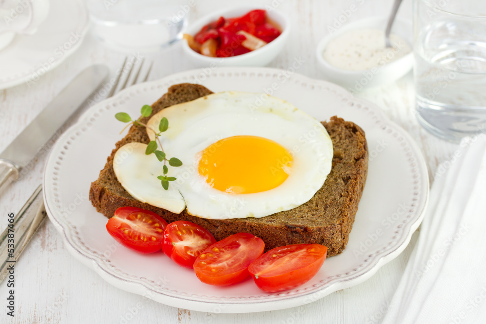 egg with black bread and tomato cherry egg with black bread and tomato cherry