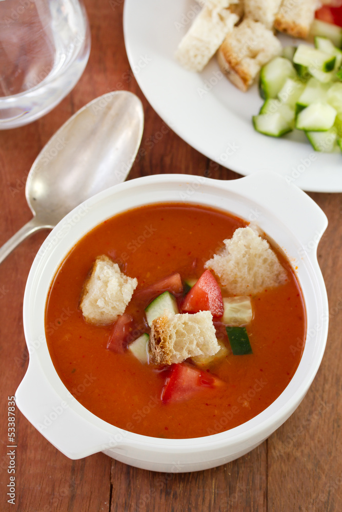 tomato soup with spoon and glass of water tomato soup with spoon and glass of water