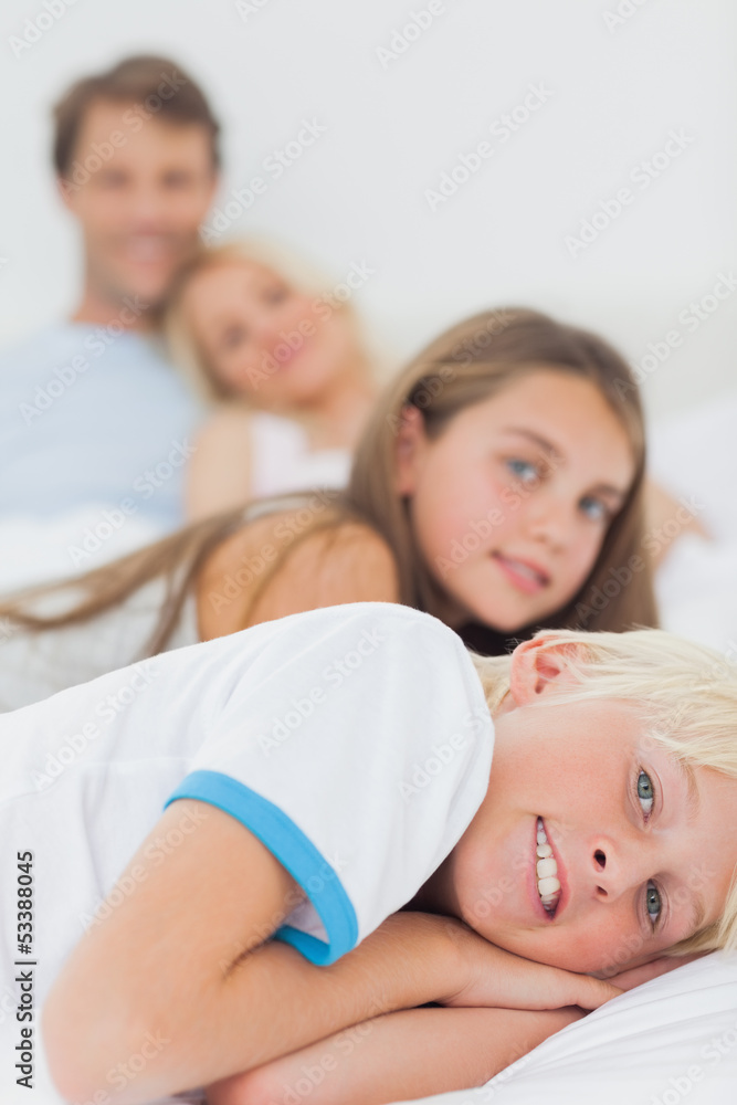 Children resting in the bed of their parents Children resting in the bed of their parents