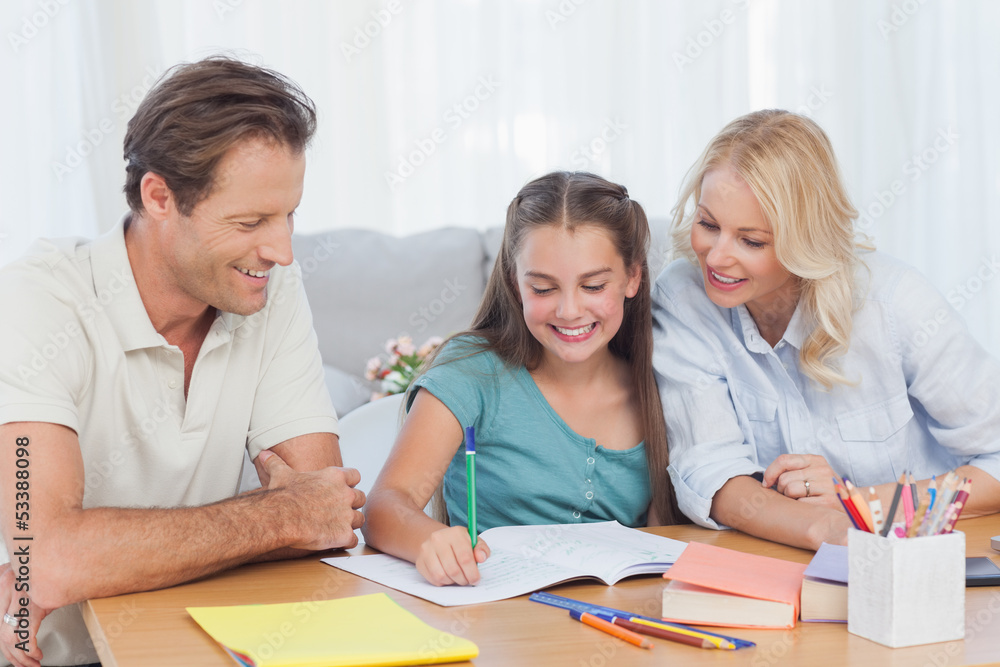 Parents helping her daughter doing her homework Parents helping her daughter doing her homework