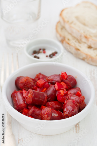 fried sausages in white bowl and bread