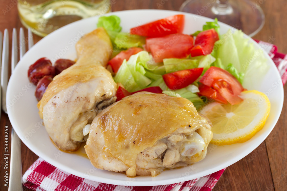 fried chicken with salad on white plate