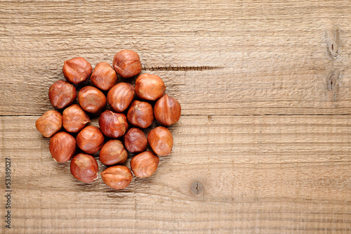 Hazelnuts on wooden background