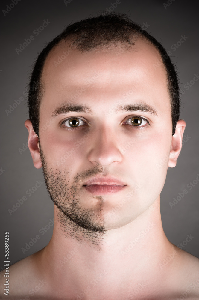 Fototapeta premium portrait of a handsome man with a shaved half his face