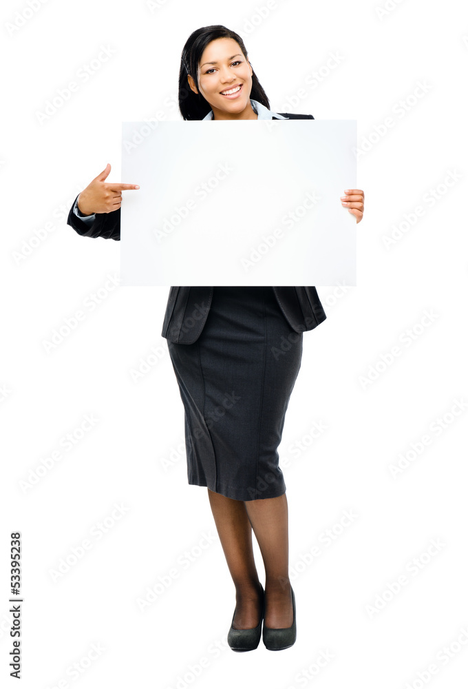 Happy mixed race business woman pointing at empty copy space iso Happy mixed race business woman pointing at empty copy space iso