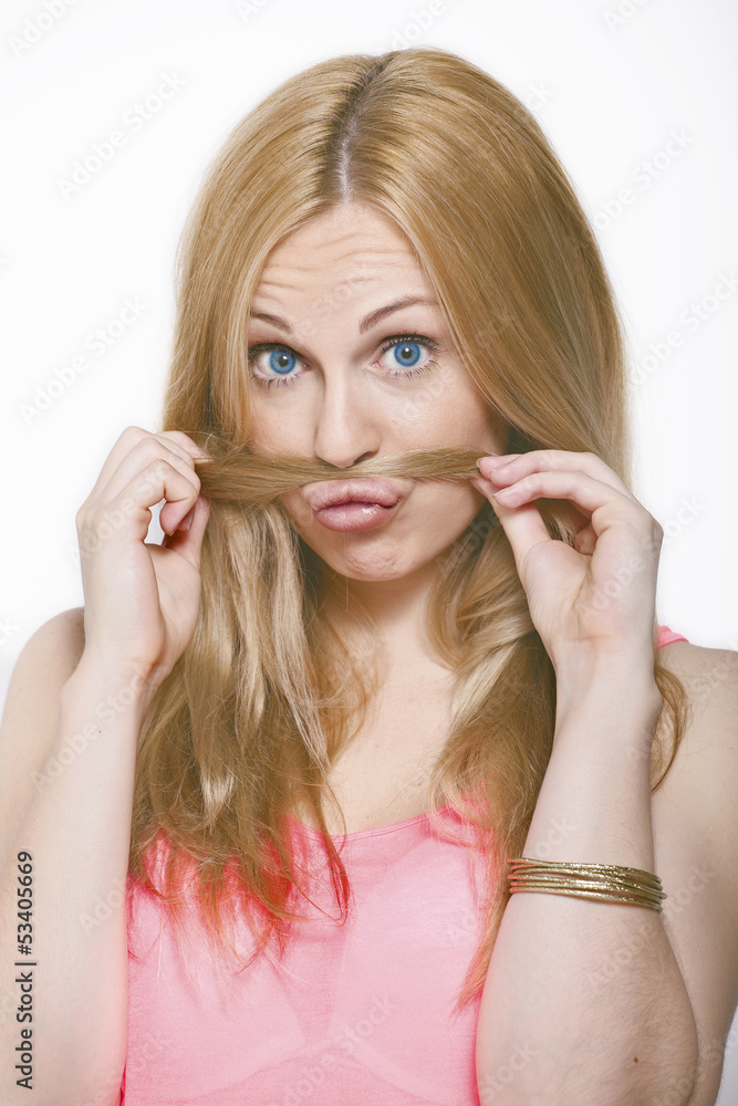 Happy model in studio making funny faces. Happy model in studio making funny faces.