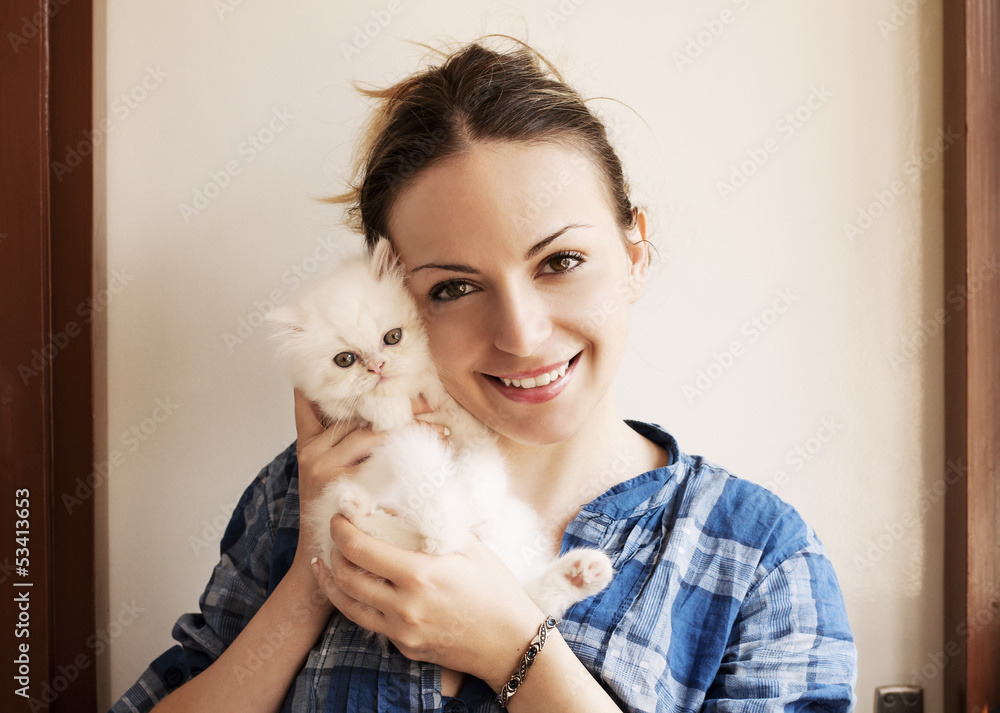 Girl holding white kitten Girl holding white kitten