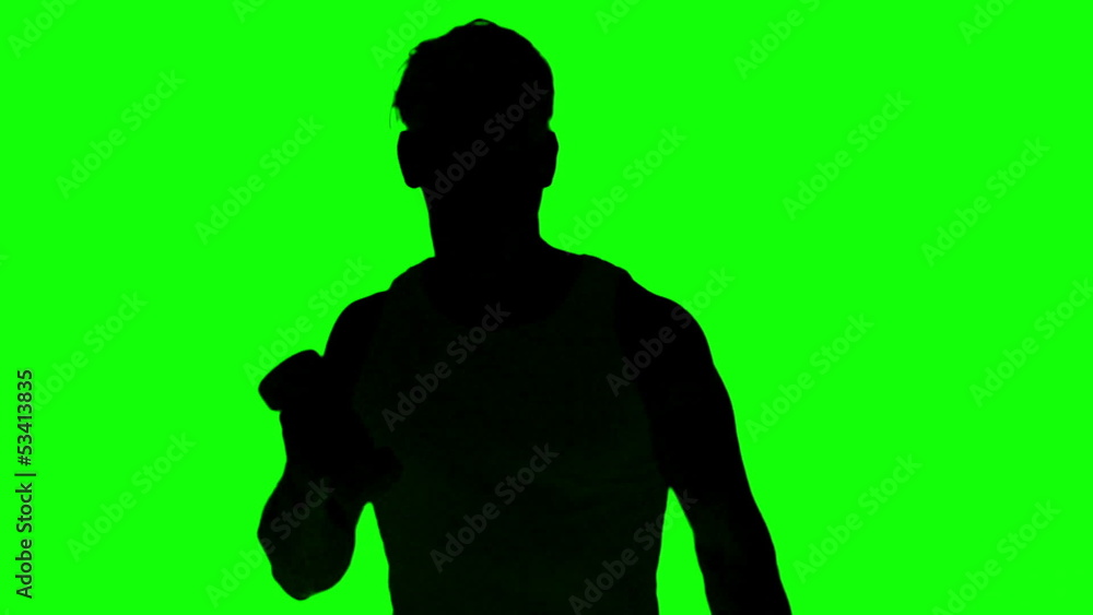 Silhouette of a man lifting dumbbells on green screen Silhouette of a man lifting dumbbells on green screen