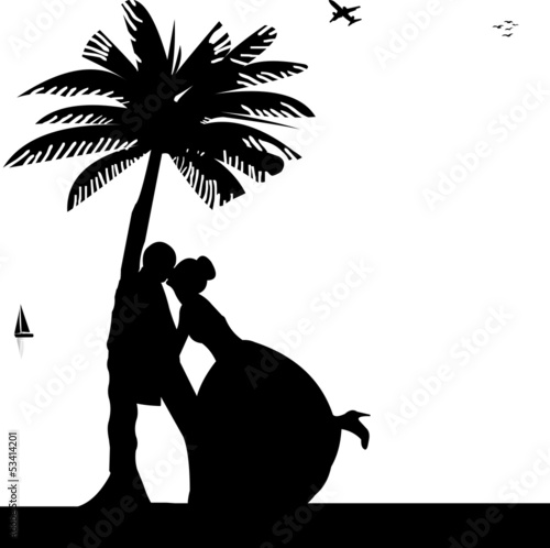 Wedding couple on the beach under the palm tree silhouette