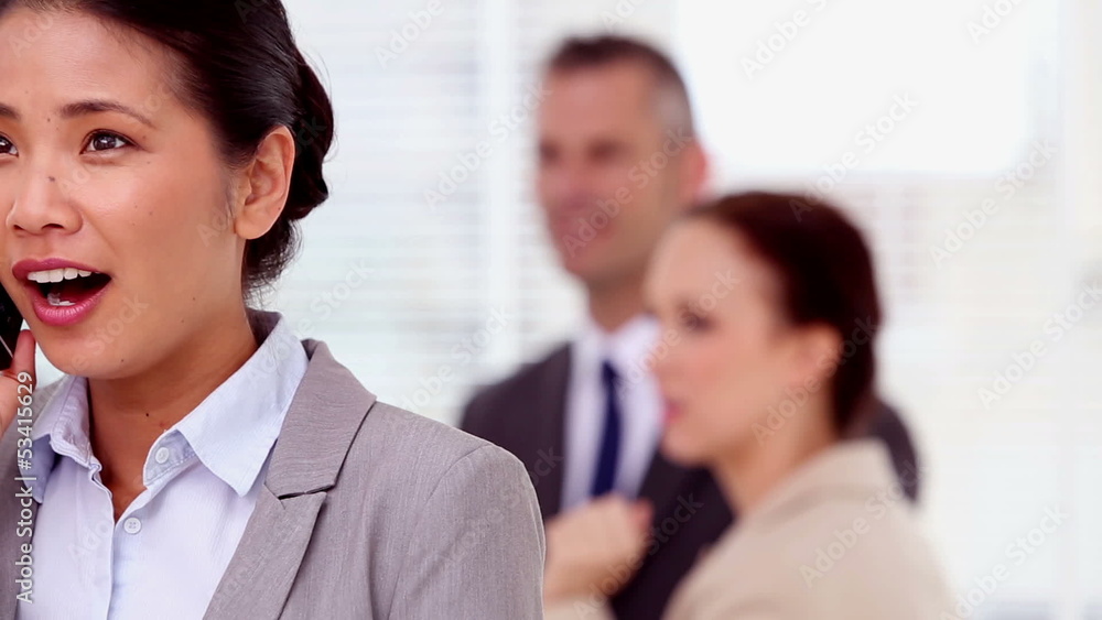 Happy businesswoman having a phone conversation Happy businesswoman having a phone conversation
