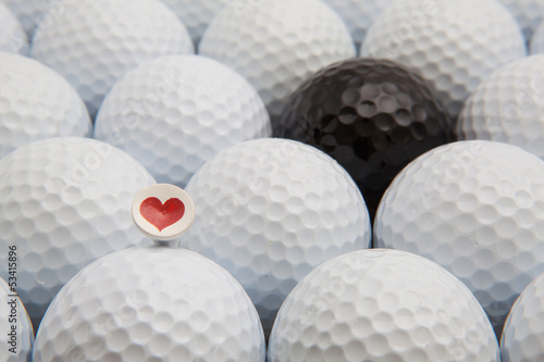 Different golf balls and romantic tee