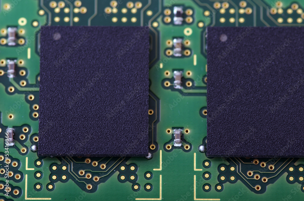 Green computer board with chips and components.