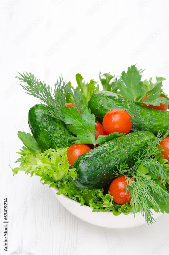bowl with fresh vegetables for salad vertical close-up bowl with fresh vegetables for salad vertical close-up
