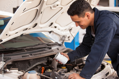 Changing the oil filter in a shop