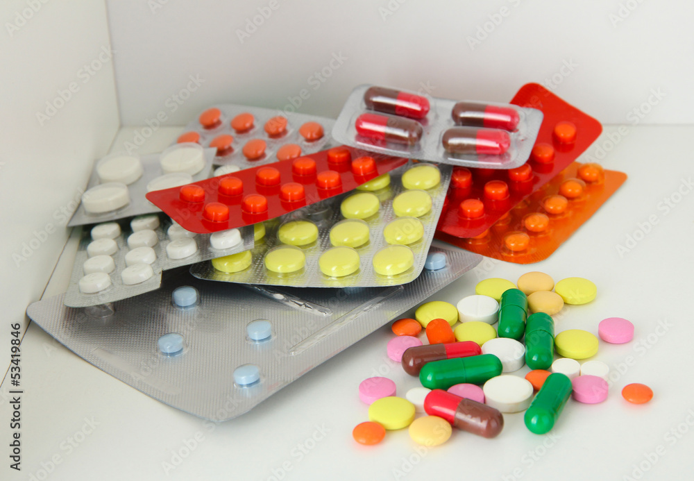 Colorful pills and capsules on shelf Colorful pills and capsules on shelf