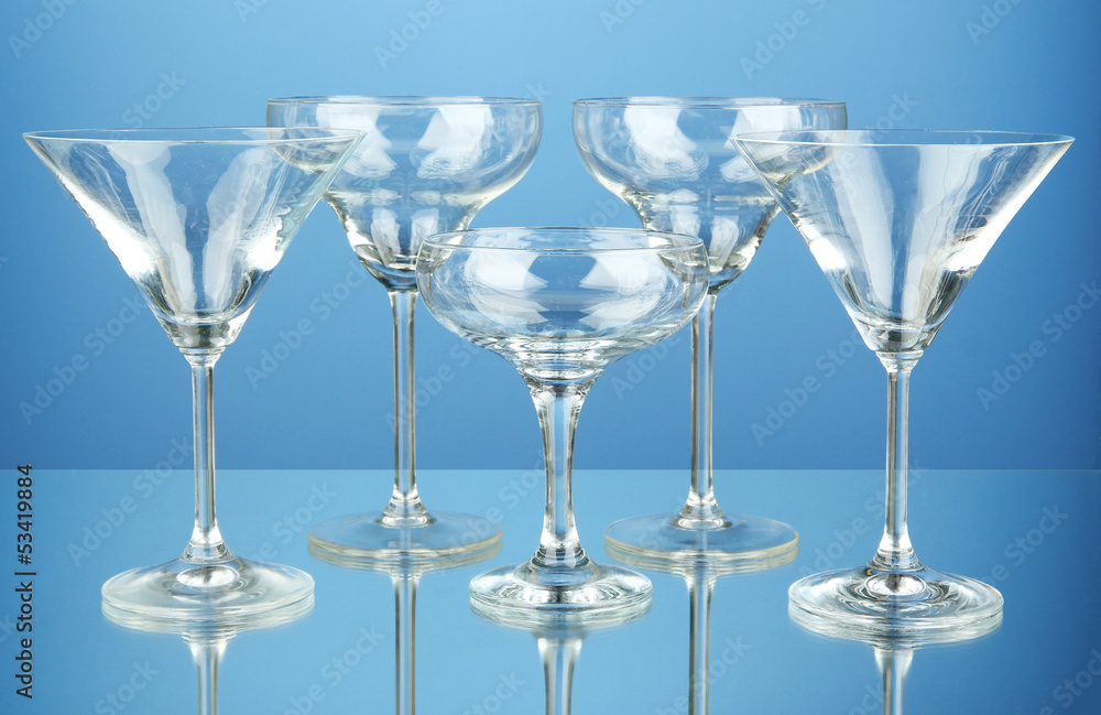 Cocktail glass set on blue background Cocktail glass set on blue background