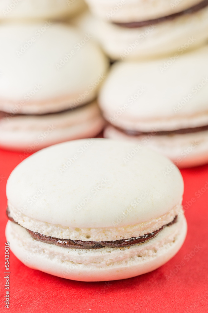French vanilla macarons with chocolate buttercream fillings French vanilla macarons with chocolate buttercream fillings