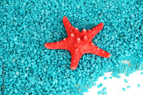 Starfish on blue crystals of sea salt background