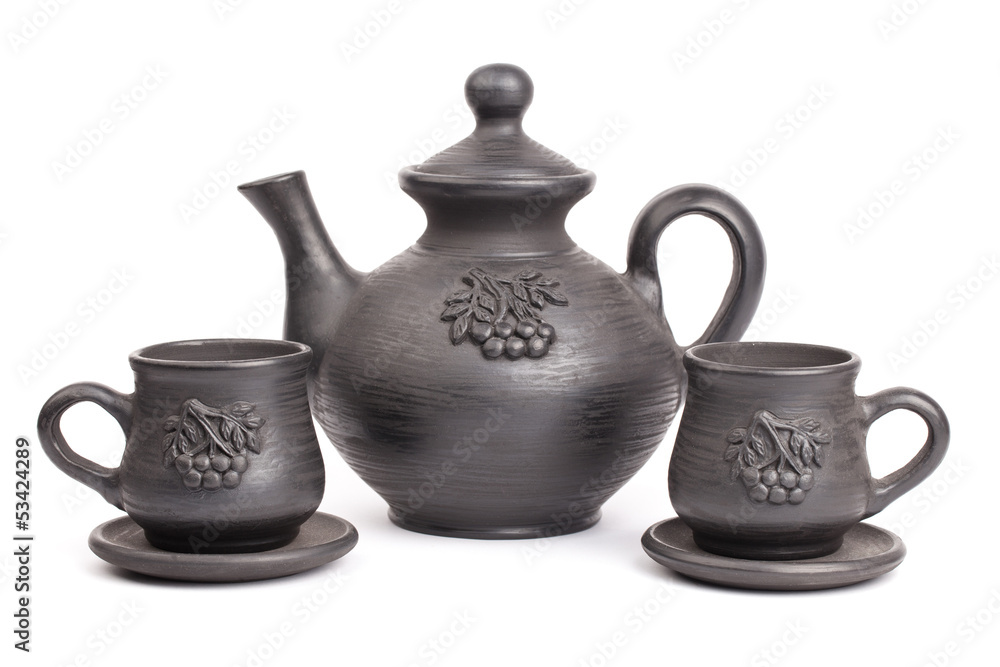 Teapot and cups isolated on a white backgrounds