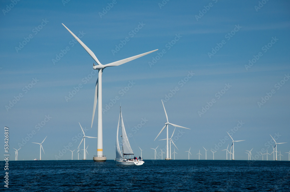 Fototapeta premium Offshore wind farm + yacht